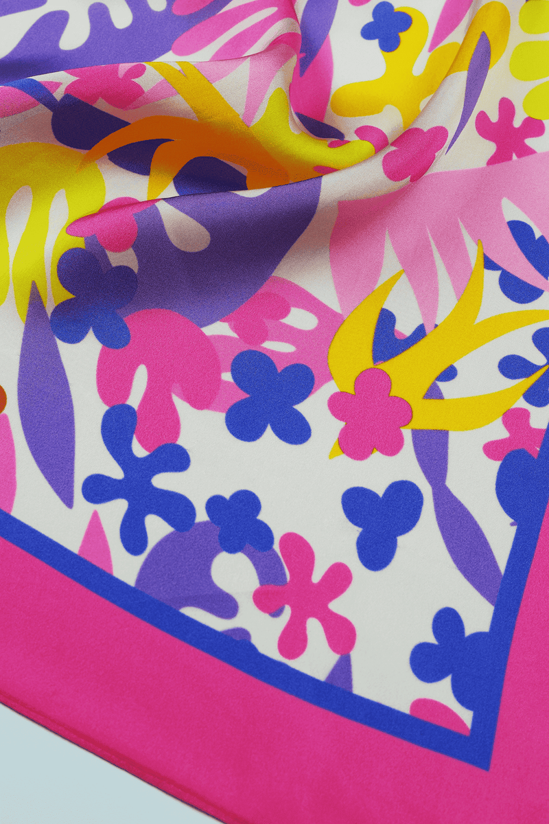 Colorful abstract floral pattern on scarf with pink and blue border