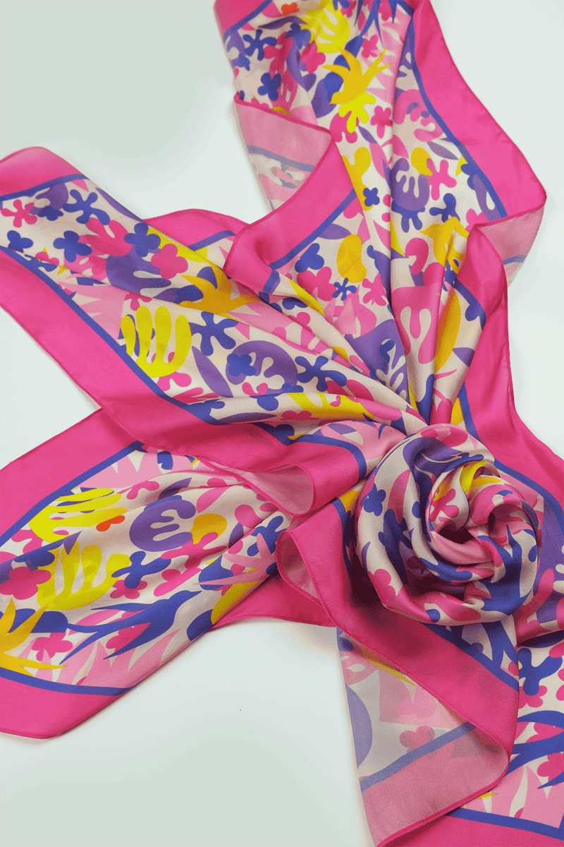 Colorful scarf with abstract patterns arranged on a white background